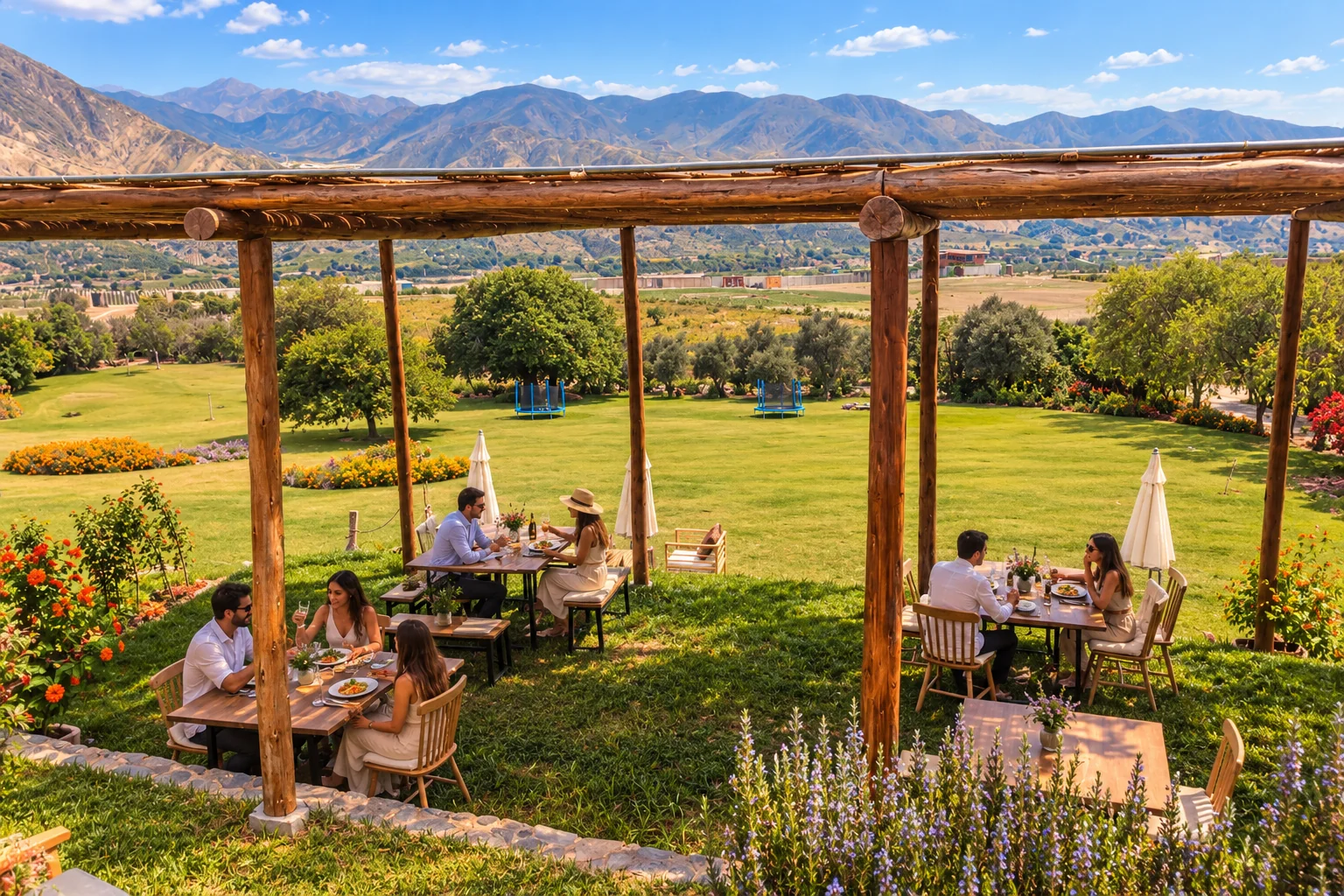 Terraza del restaurante Andenes de Azpitia con mesas al aire libre y vista al valle